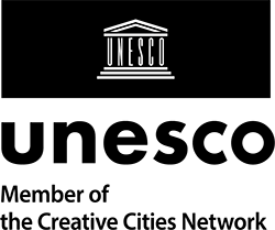 Logo "Unesco" as member of the global alliance of creative Cities